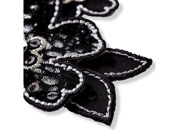 Applikasjon, svart blomst